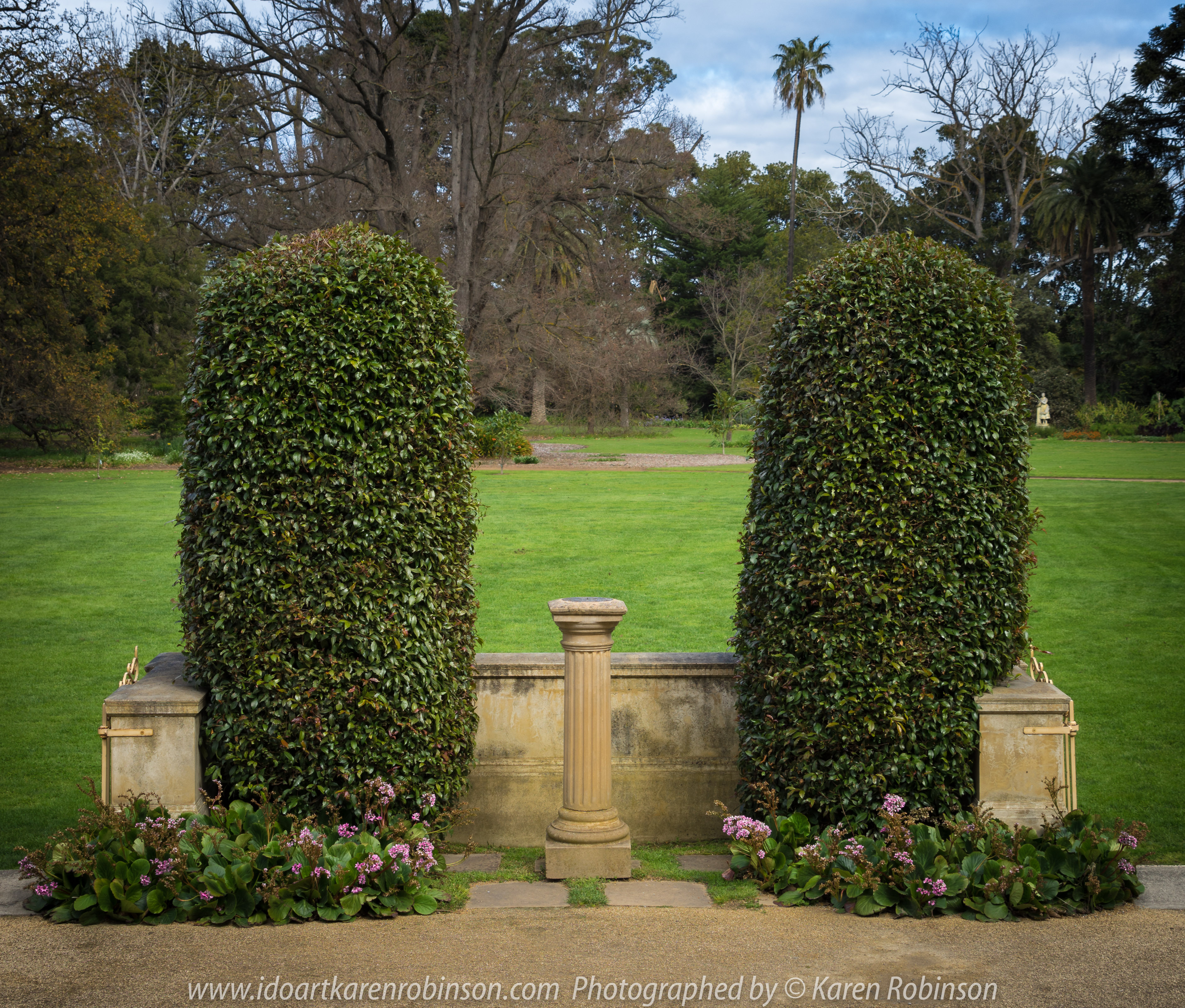 Elsternwick, Victoria - Australia_Photographed by ©Karen Robinson_ www.idoartkarenrobinson.com September 10, 2017 Comments: My hubby and I with the Craigieburn Camera Club at Rippon Lea House and Gardens. "It is one of Australia's finest grand suburban estates and the first to achieve National Heritage Listing, recognising its unique significance. The historic mansion is located within a vast pleasure garden of sweeping lawns that cover more than 14 acres and features a windmill, lookout tower, heritage orchard, lake, waterfall, fernery and more!" Photograph featuring trimmed hedges and sundial.