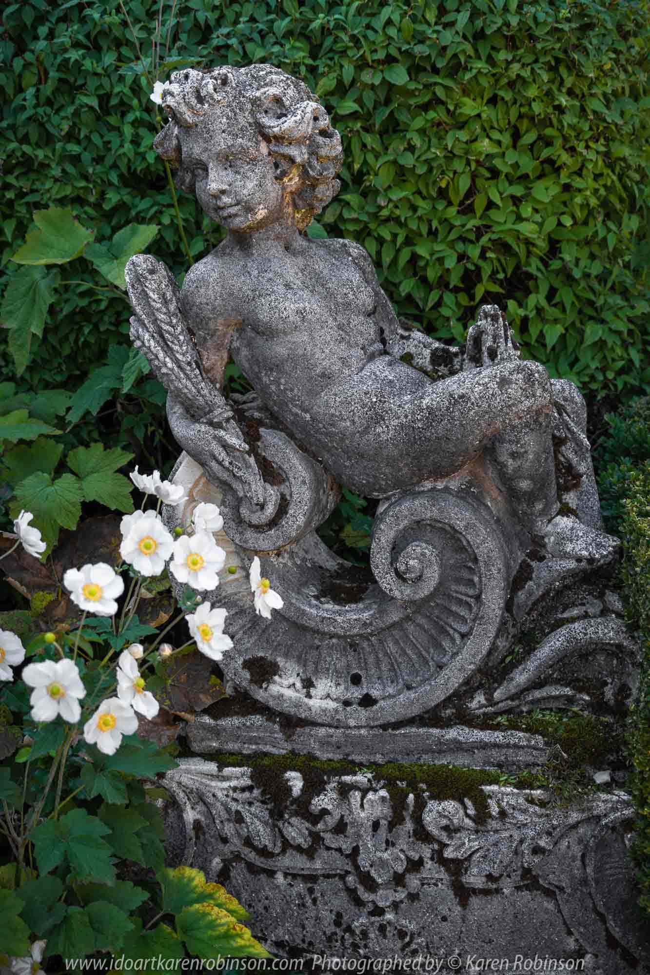 Mount Macedon, Victoria - Australia 'Duneira Heritage Garden' Photographed by Karen Robinson April 2019 Comments - A beautiful Autumn day with hubby at these magnificent gardens where tall trees are the dominating feature. Photograph featuring statue beside Main House stairway.